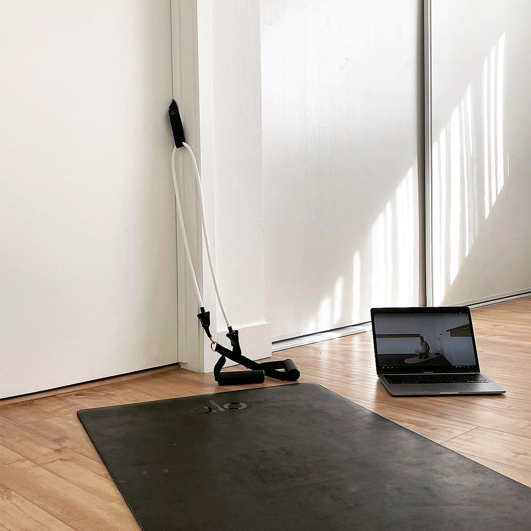 Excercise set using resistance band pilates mini reformer travel kit at home using a video guide