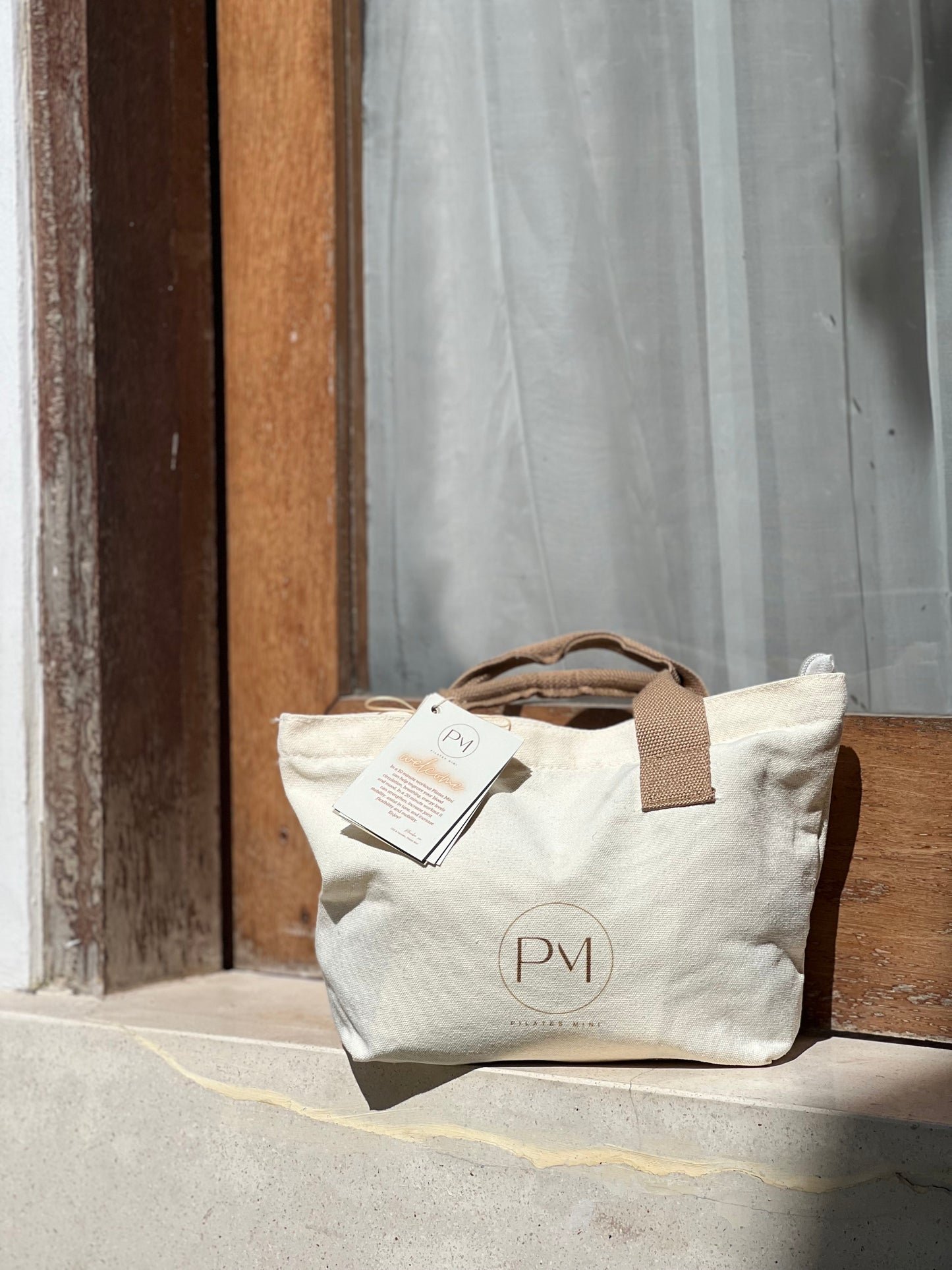 Beige tote bag for carrying resistance bands