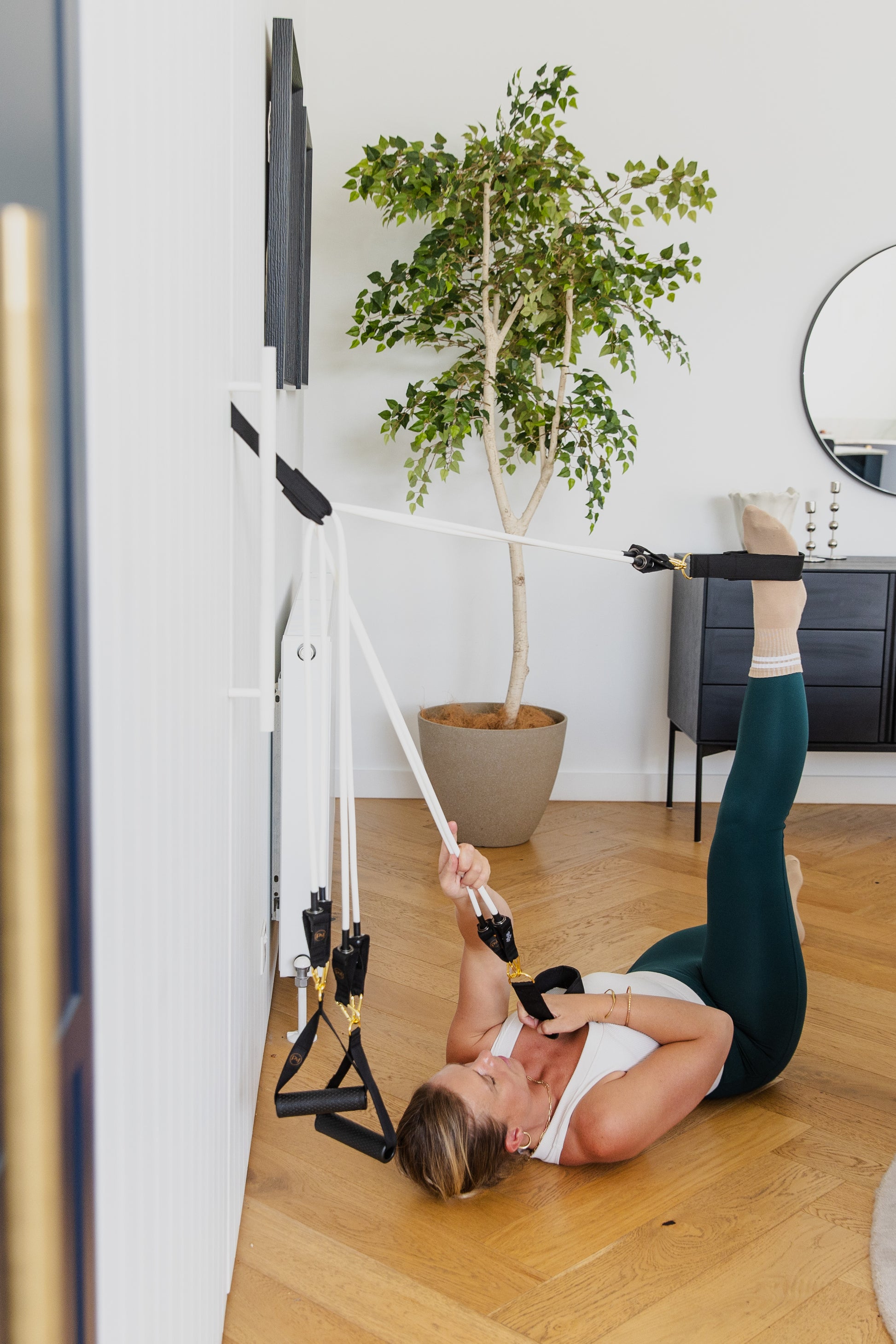 Woman exercising with a resistance band in a home setting