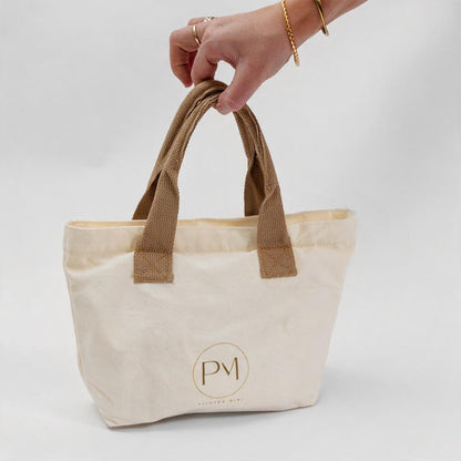 Beige tote bag with brown handles for pilates mini resistance bands travel kit